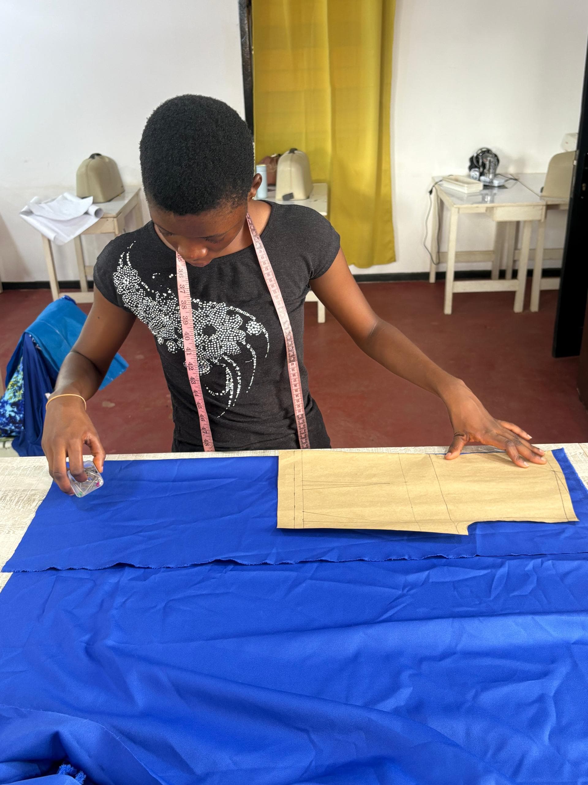 Students working on pattern drafting at Saby Cobbs