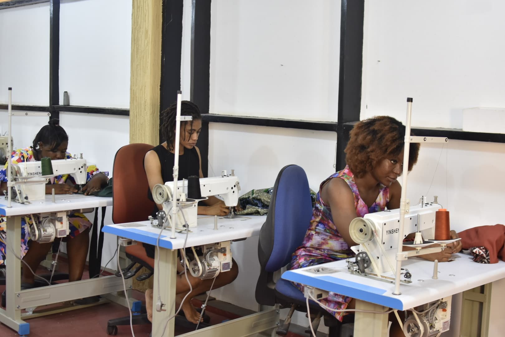 Students working on sewing machines at Saby Cobbs School of Arts